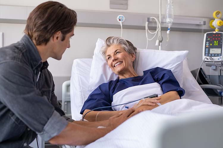 mother and son at hospital bed